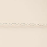 Silver chain on a beige background