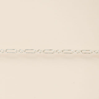 Silver chain on a beige background