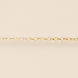 Gold chain on a beige background