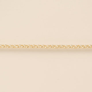 Gold chain on a beige background