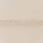 Gold chain on a beige background