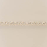 Gold chain on a beige background