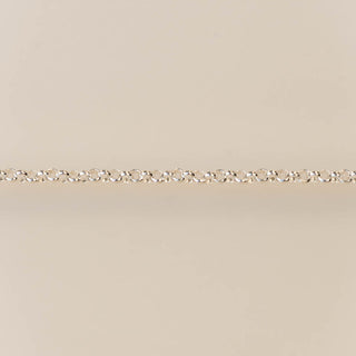 Gold chain on a beige background
