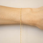 gold chain on wrist for permanent jewelry