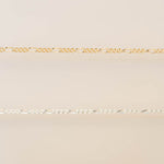 Gold chain on a beige background