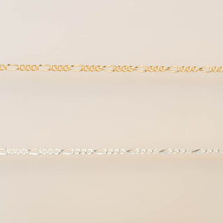 Gold chain on a beige background