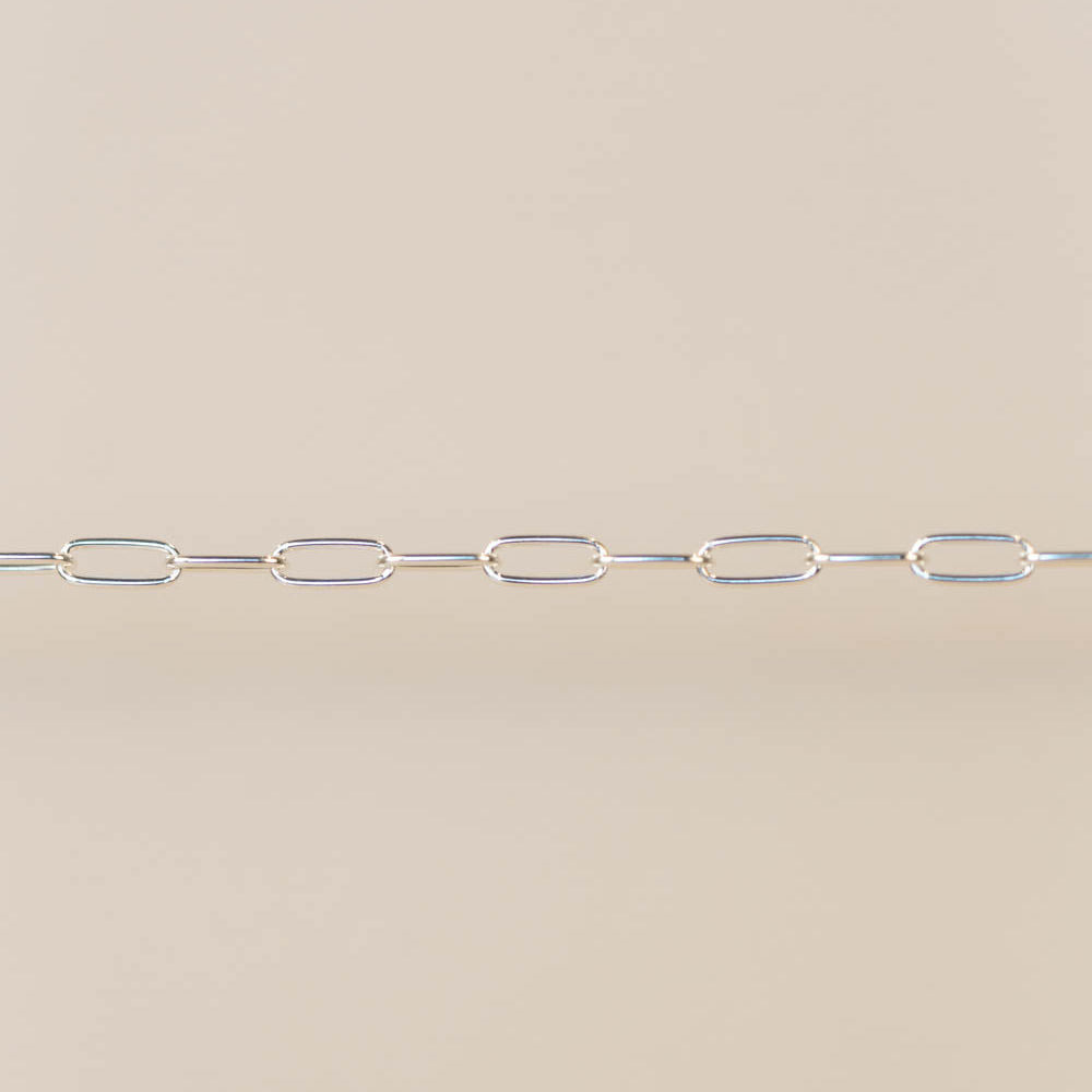 Silver chain on a beige background