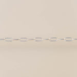 Silver chain on a beige background