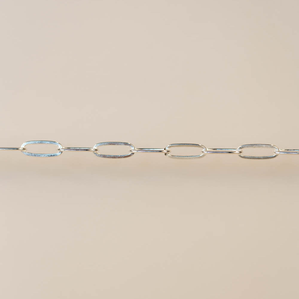 Silver chain on a beige background