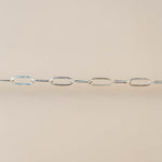 Silver chain on a beige background