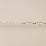 Silver chain on a beige background