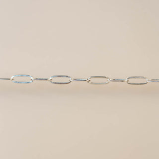 Silver chain on a beige background