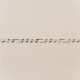 Silver chain on a beige background