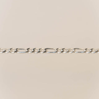 Silver chain on a beige background