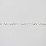 Silver chain on a light gray background