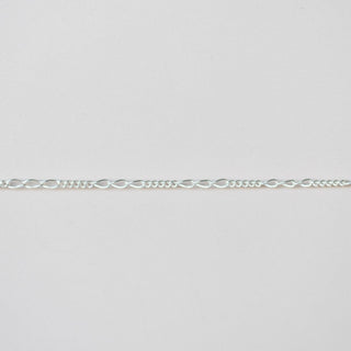 Silver chain on a light gray background