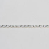 Silver chain on a light gray background