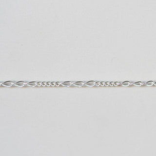 Silver chain on a light gray background