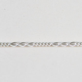 Silver chain on a light gray background