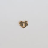 Heart-shaped charm with the number '1' on a light gray background