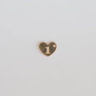 Heart-shaped charm with the number '1' on a light gray background