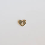 Heart-shaped gold charm with a number '4' on a light gray background