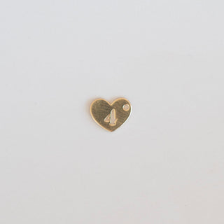 Heart-shaped gold charm with a number '4' on a light gray background