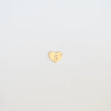 Gold heart-shaped charm with a number '5' on a light gray background