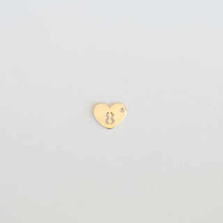 Gold heart-shaped charm with number '8' on a light gray background