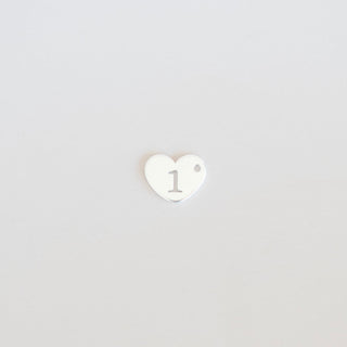 Heart-shaped logo with a white center and black outline on a light gray background