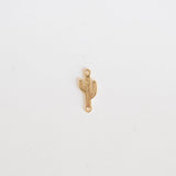 Gold cactus-shaped pendant on a white background