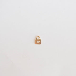 Small gold padlock on a light gray background