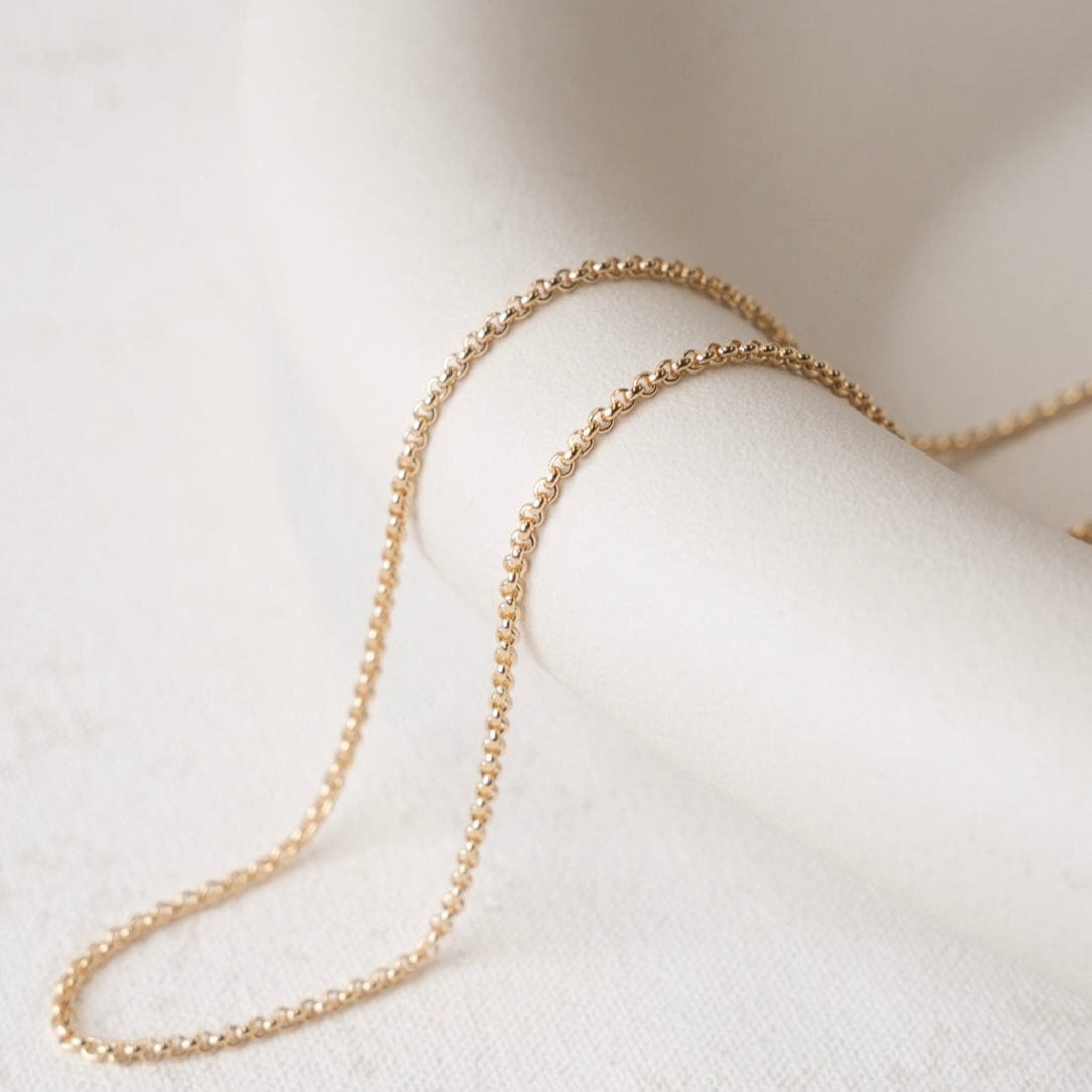 Gold chain necklace on white background