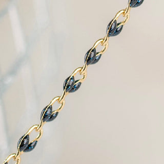 Gold and black chain detail, FullSizeRender