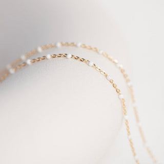 Gold chain necklace detail