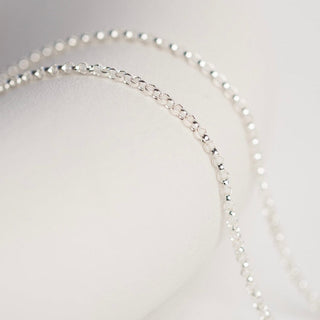 Silver beaded necklace detail