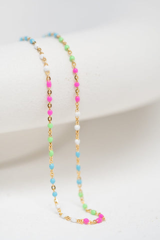 Colorful beaded necklace on a white background.