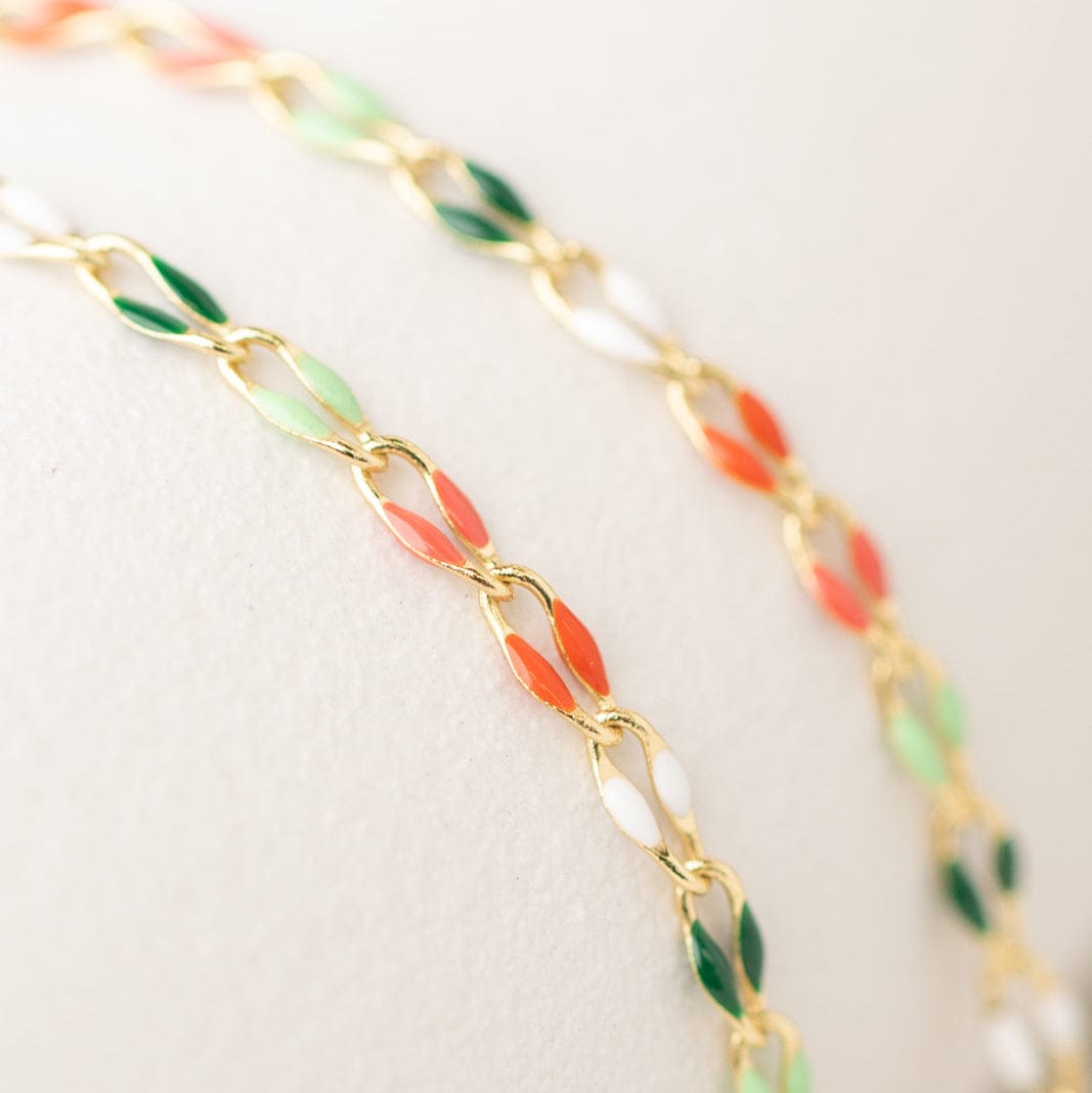 Gold chain with colorful oval links.