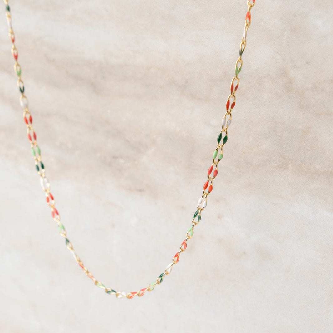Gold chain necklace with colorful links.