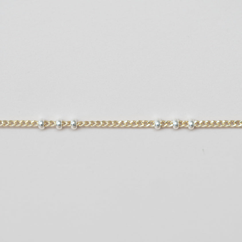 Mixed metal satellite chain for permanent jewelry