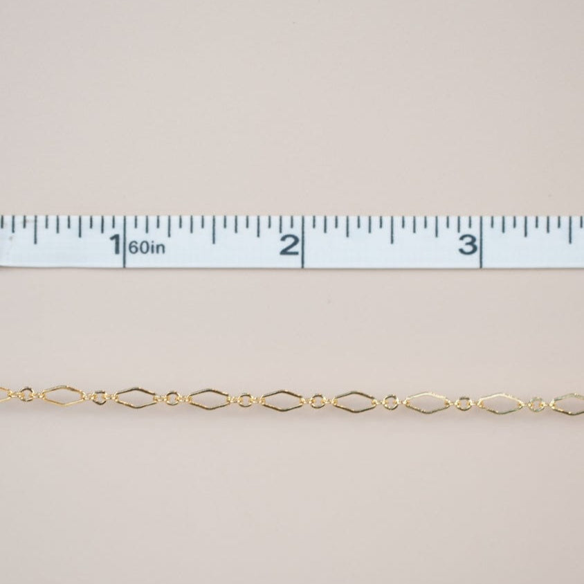 Gold chain with ruler for scale