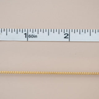 Gold chain with measurement ruler