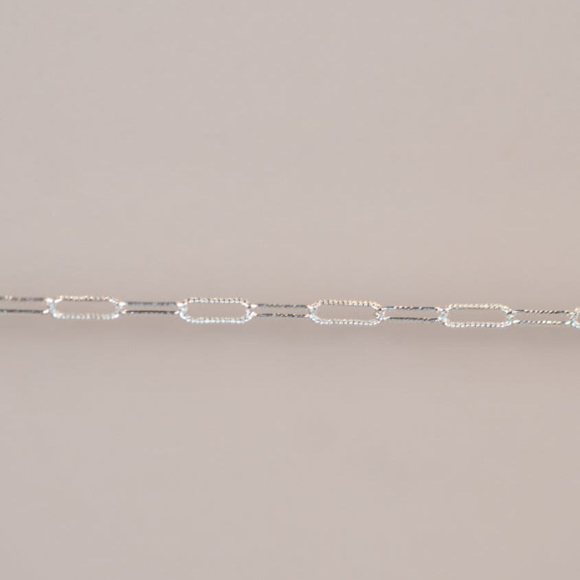 silver chain detail.