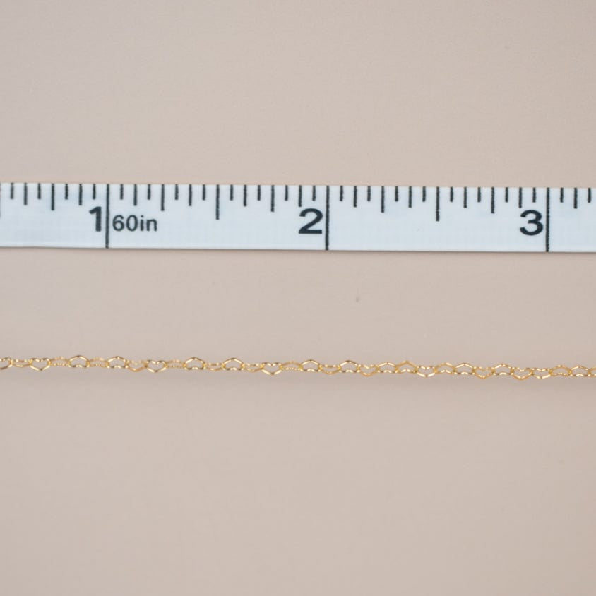 New chain arrival, gold chain measured with tape.