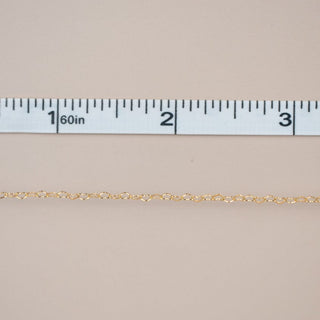 New chain arrival, gold chain measured with tape.