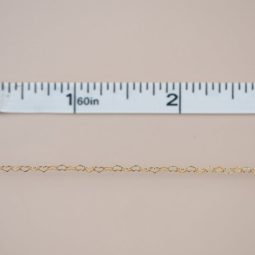 Heart chain with ruler showing size.