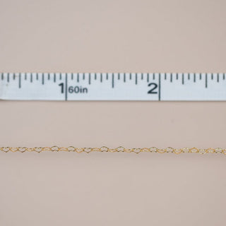 Heart chain with ruler showing size.