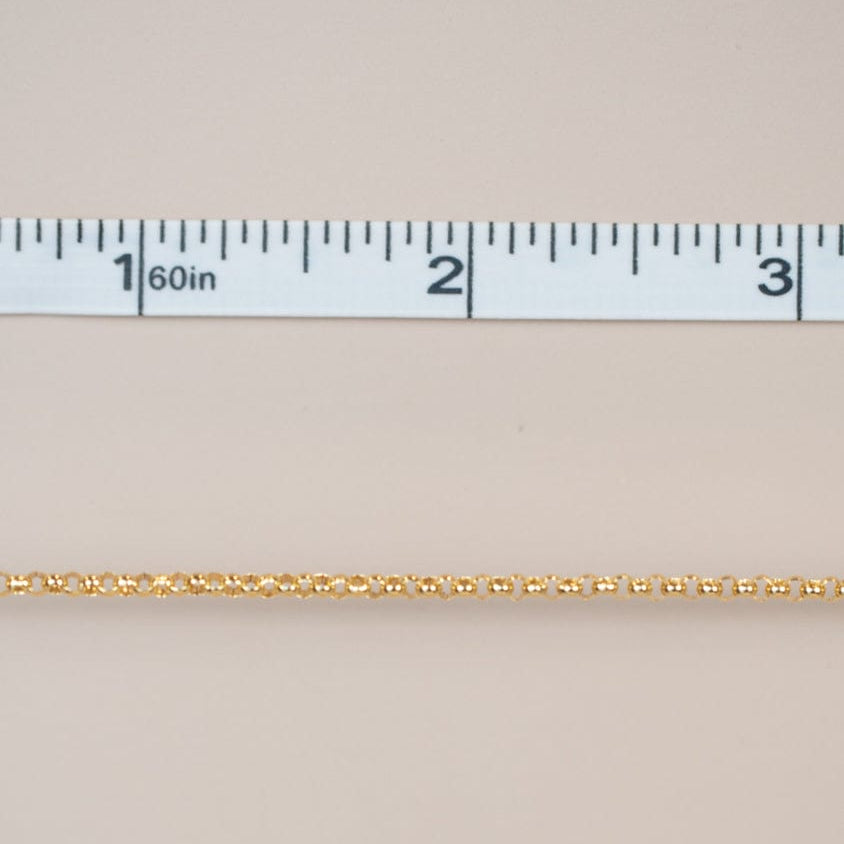 Gold chain measured with ruler