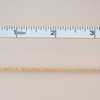 Gold chain measured with ruler