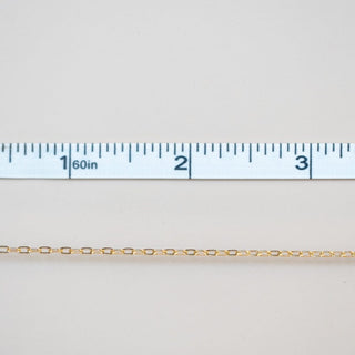 Permanent jewelry chain being measured.